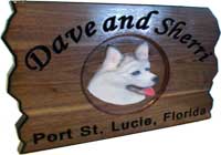 Carved wood signs of pets and animals