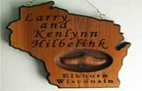 Wood sign shaped like a state